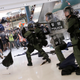 Riot police use pepper spray to disperse protesters inside a shopping mall in Hong Kong, July 14, 2019.